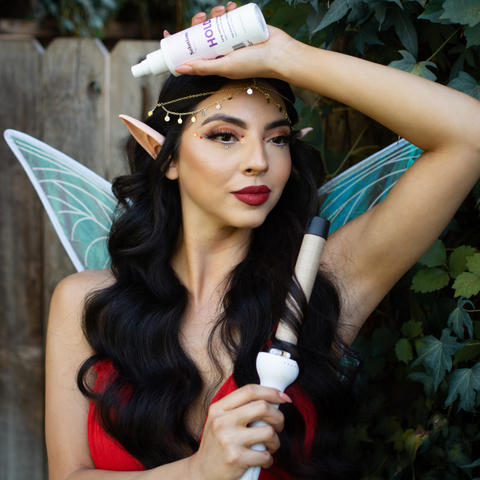 Fire Sign Fairy holding HOLD Hair Spray and CERASILK Curling Wand